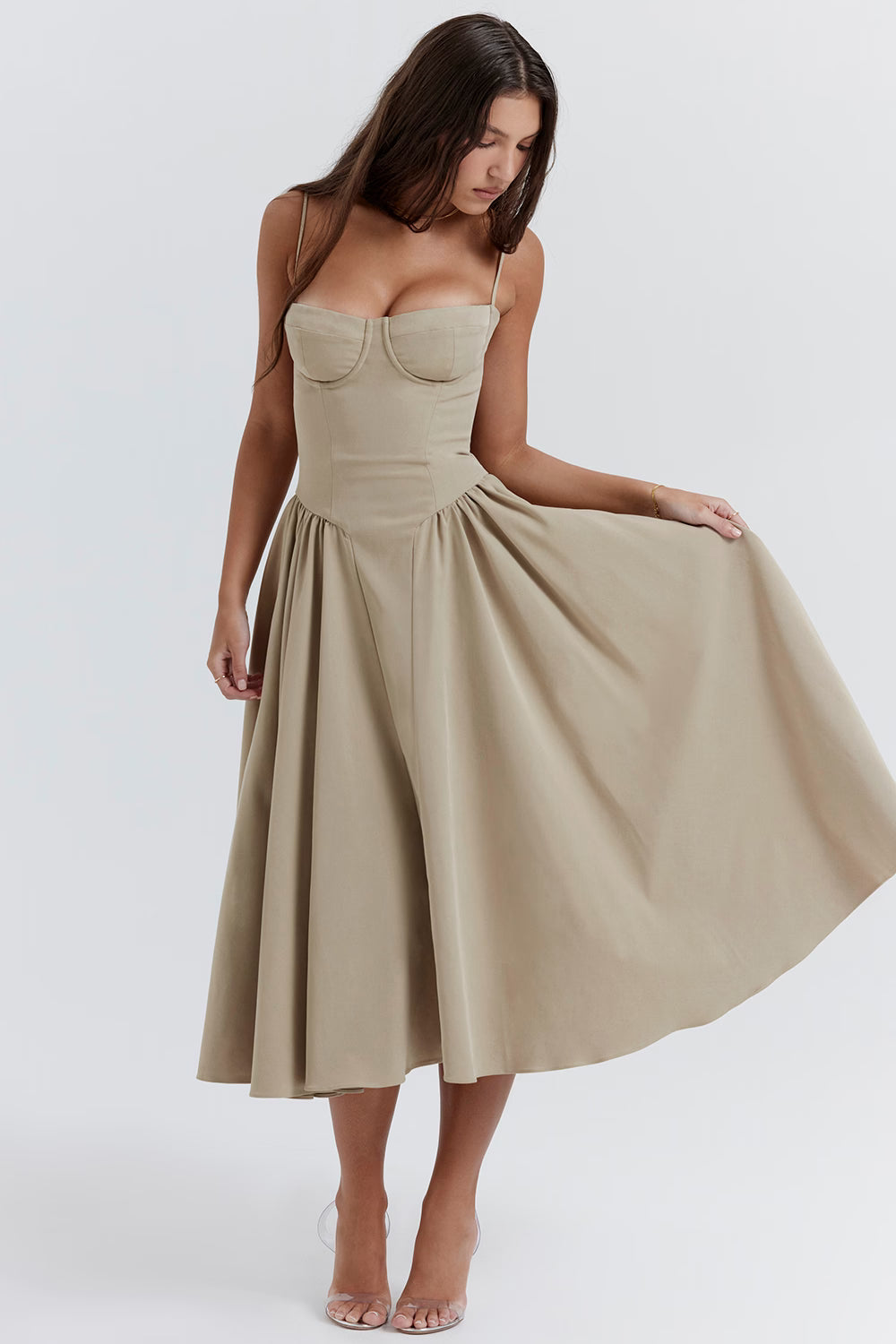 Woman wearing a beige Cherry Khaki dress on a white background