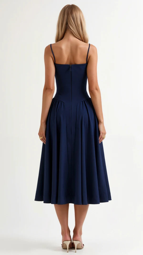 Navy blue dress worn by a model on a white background