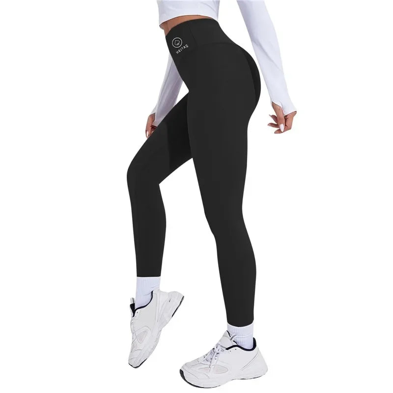Person wearing Onyx black leggings with a logo on a white background