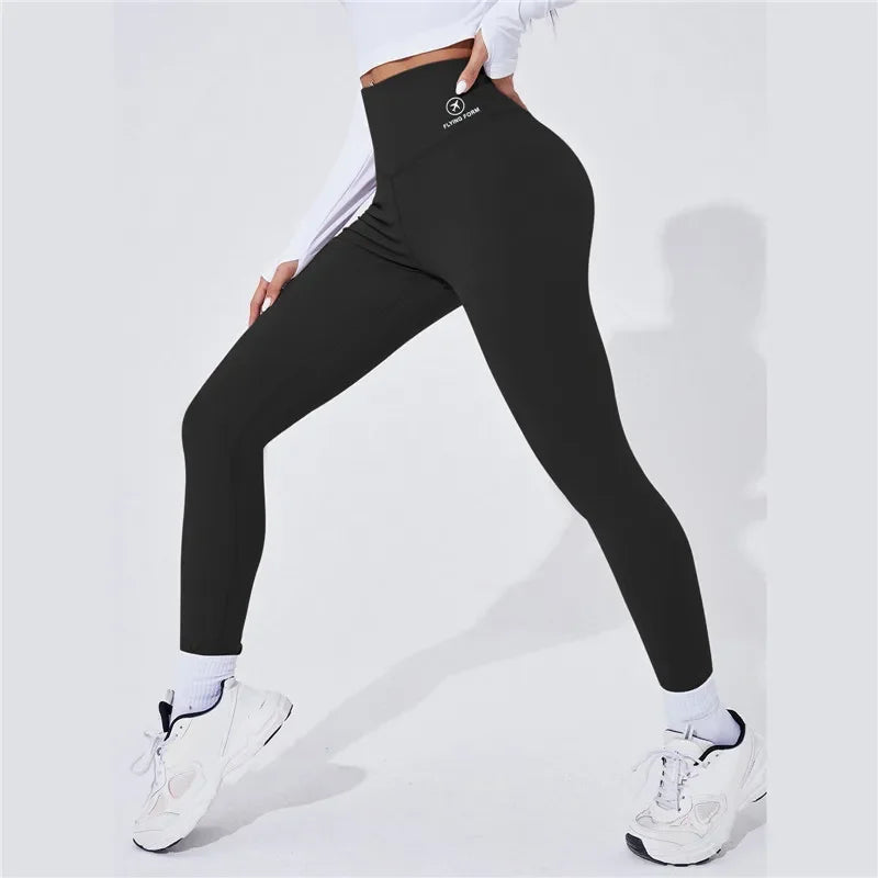 Person wearing Onyx leggings with a visible brand logo on a white background