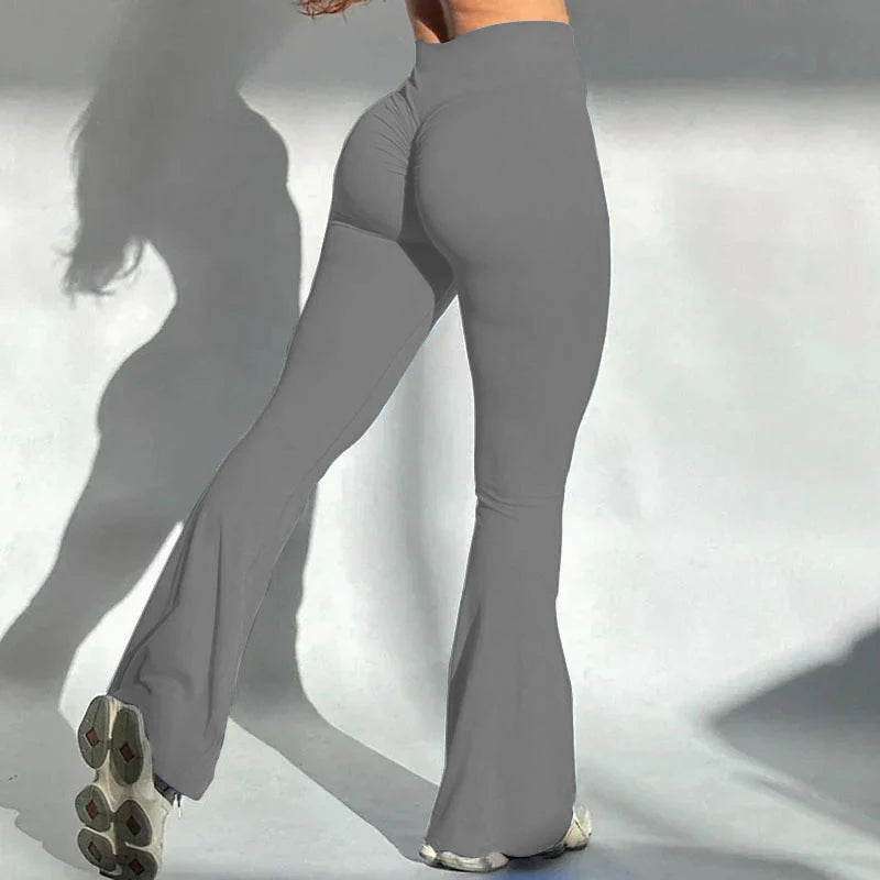 Light Heather Grey flared pants worn by a person on a plain background