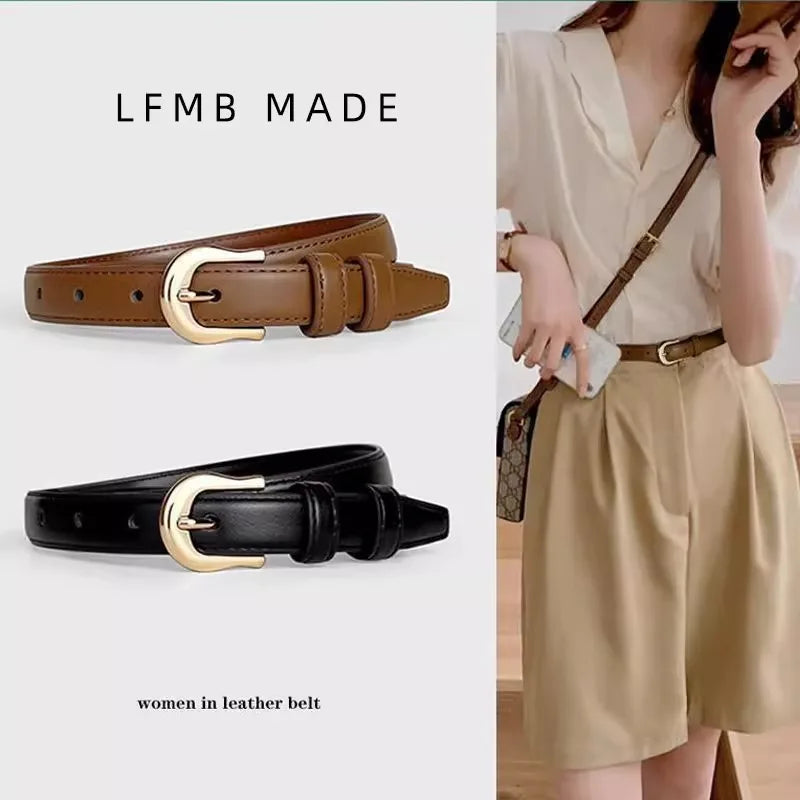 Brown and black leather belts with gold buckles, one worn by a person in a beige dress.
